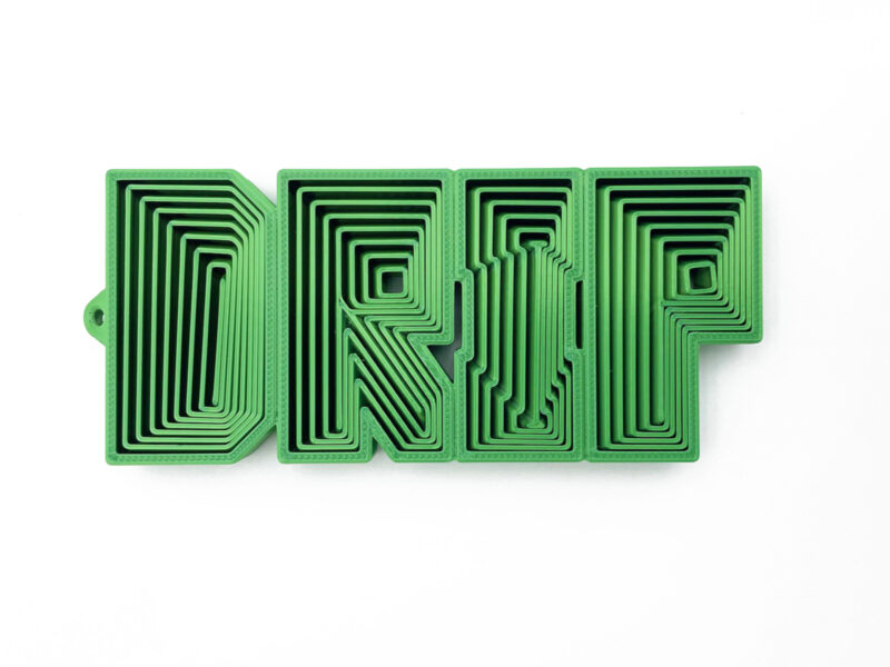 DRIP fidget toy in icy blue, 3D-printed flexible word with nested letters and smooth curves