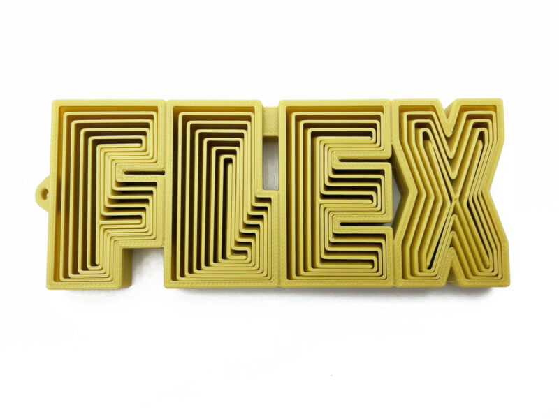 FLEX word fidget in black, bendable 3D-printed toy with stretchy lettering