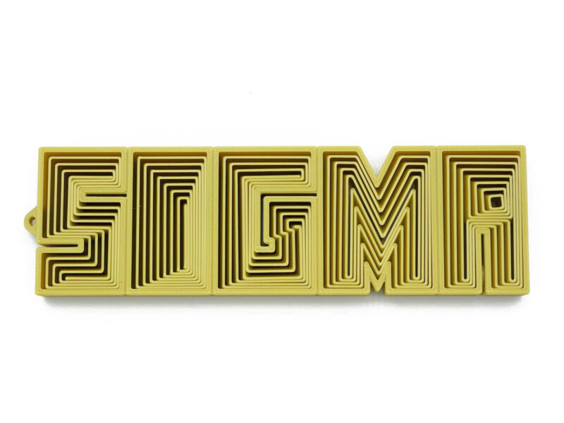 SIGMA flexible fidget toy in gold, 3D-printed with bold nested letters